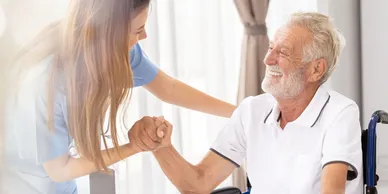 A woman holding hands with an older man.