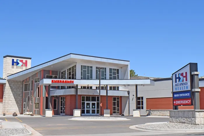 A large building with a red sign on the front.