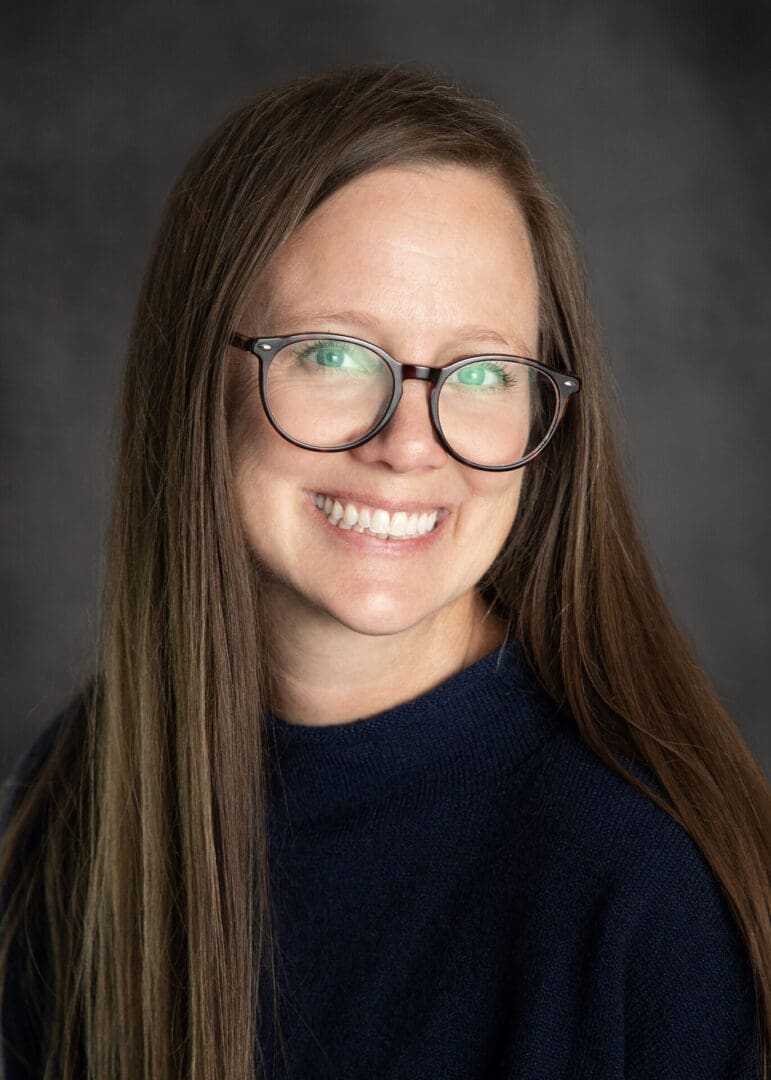 HSH board member, Jennifer Cheney smiles for the camera in navy sweater.